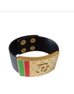 A wristband with a gold plate